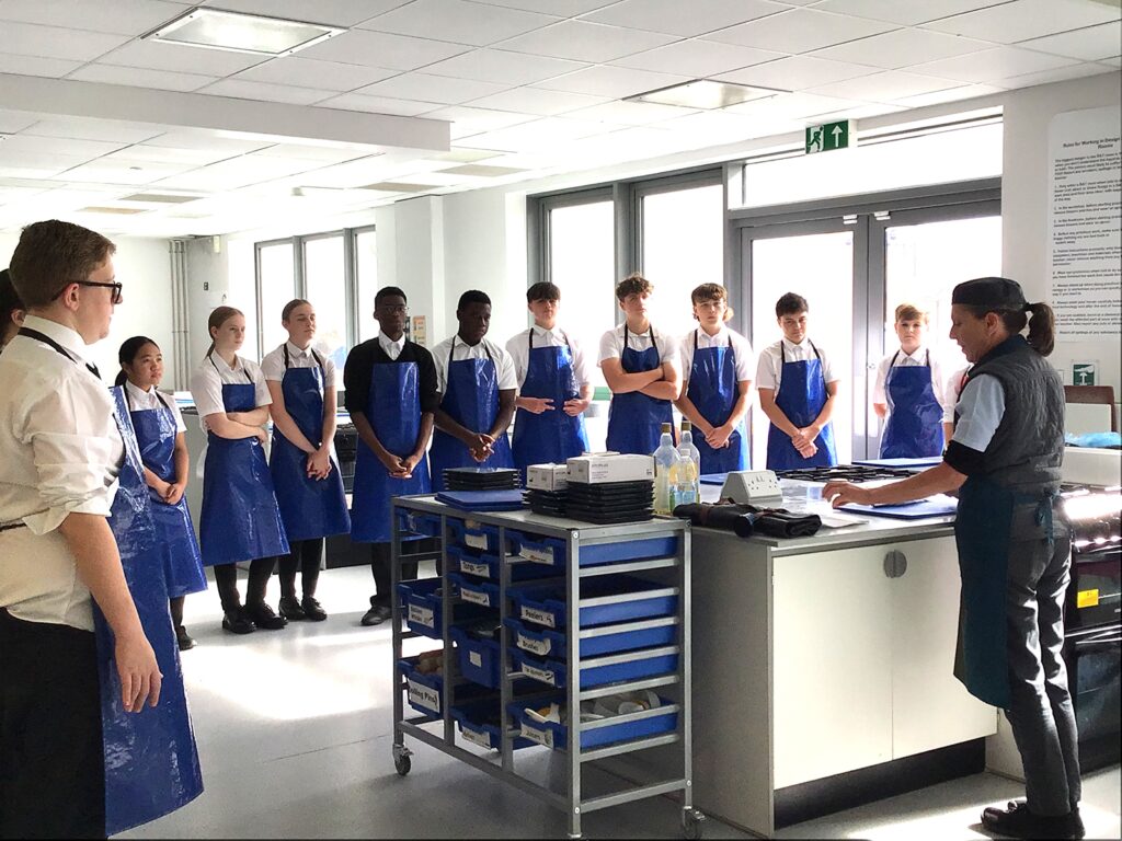 Hospitality and catering students learn to fillet fish